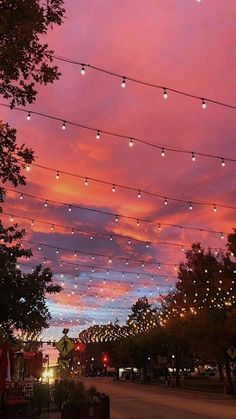 the sky is filled with lights and string lights