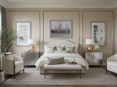 a bedroom with beige walls, white furniture and pictures on the wall above the bed