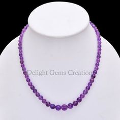 Product Details : Item Code : DGC093Gemstone Name :  Purple Amethyst Chain Style : BEADEDBeads Shape : Smooth RoundBeads Size : 5-10 MM ApproxLength : 18" Inch ApproxWeight : 136 Cts. ApproxCustomization : **Available**Please Feel Free To Contact If You Have Any Query. Purple Round Crystal Healing Necklace, Purple Crystal Healing Necklace, Lavender Round Beads Spiritual Necklace, Purple Beaded Necklace With 8mm Beads As Gift, Purple Beaded Necklaces With 8mm Beads As Gift, Purple Beaded Necklaces With 8mm Beads For Gifts, Purple Amethyst Necklace With 8mm Beads, Lavender Round Bead Crystal Necklaces, Lavender Crystal Necklaces With Round Beads