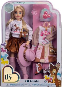 the doll is wearing a pink hat and dress up outfit with a deer on it