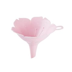 a pink flower shaped vase sitting on top of a white table