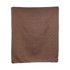 a brown quilted blanket on a white background