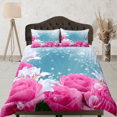 a bed with pink flowers and bubbles on it