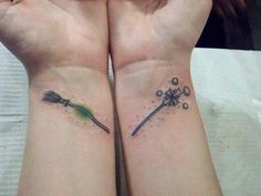 two matching wrist tattoos with arrows and stars on the wrists, one has a green arrow