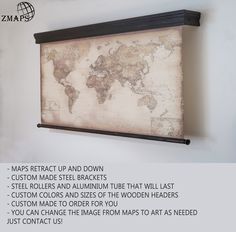 an old world map hanging on the wall with text below it that reads maps reflect up and down custom made steel brackets