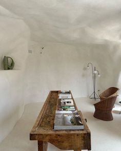 a wooden table sitting in the middle of a room