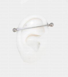 an ear with two balls attached to it