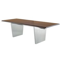 a wooden table with metal legs and a white base on the top, against a white background