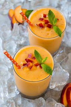 two glasses filled with peach smoothie and garnished with mint