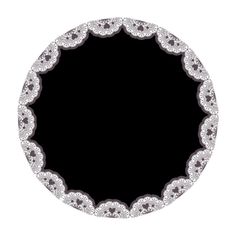 a black and white circular frame with diamonds