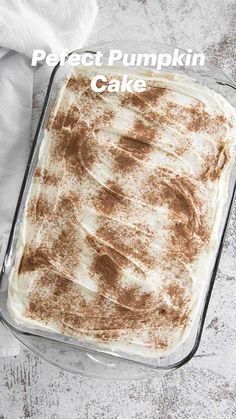 an uncooked dessert in a glass baking dish on a white tablecloth and napkin