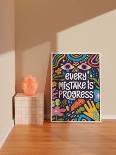 there is a sign that says every mistake is progress on the wall next to it