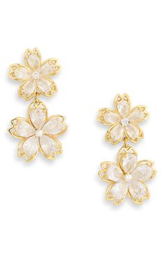 Bright and brilliant CZ stones sparkle in the open petals of double flower drop earrings. 0.85" drop Post back Goldtone plate/cubic zirconia Imported Gold Flower Earrings, Gold Flower-shaped Cluster Earrings For Wedding, Elegant 14k Gold Flower-shaped Earrings, Whimsical Gold Flower-shaped Earrings, Glamorous Gold Flower-shaped Earrings, Hypoallergenic Yellow Gold Flower-shaped Earrings, Gold Flowers, Cz Stone, Flower Earrings