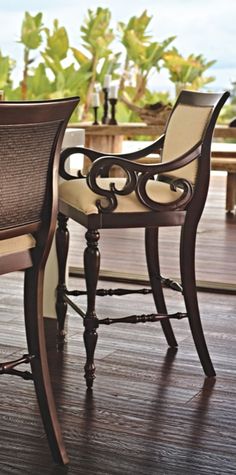 an outdoor dining table and chairs on a deck