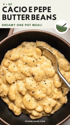 a bowl filled with macaroni and cheese on top of a table