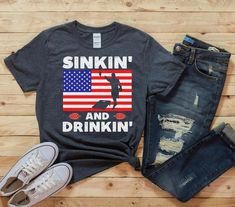 a t - shirt that says sinkin'and drinkin'with an american flag on it