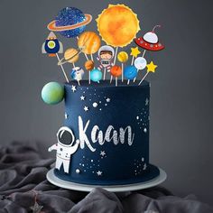 a space themed birthday cake with an astronaut theme