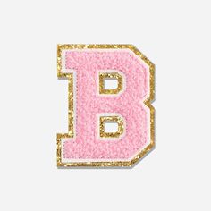 the letter b is made up of pink and gold glitters on a white background