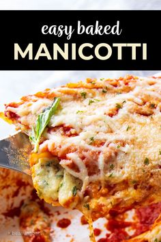 an easy baked manicotti recipe on a plate with a spatula