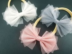 Handmade tulle bow with nylon band or alligator clip These tulle Bows are perfect for babies and girls. Click the zoom button and check out the details. Hand-made in the USA from a pet and smoke-free home. Tulle material came from South Korea. Material: Tulle, Nylon(Headband) Bow Size: 4 inches wide Color: Indian Pink, Ivory, Gray Thank you for visiting Tulle Projects, Tulle Crafts, Tulle Headband, Polka Dot Headband, Indian Pink, Headband White, Tulle Bow, Pinwheel Bow, Tulle Material