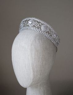 a white headpiece on a mannequin