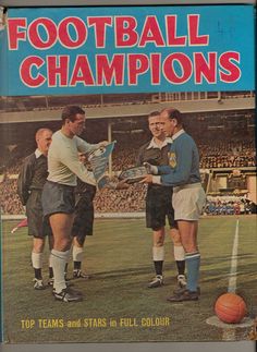 an old book with two men shaking hands in front of a soccer game on the field