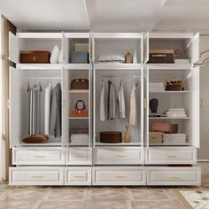 a white closet filled with lots of different types of clothing and accessories on shelves next to a door