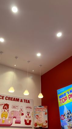 the lights are on above the ice cream and tea shop display