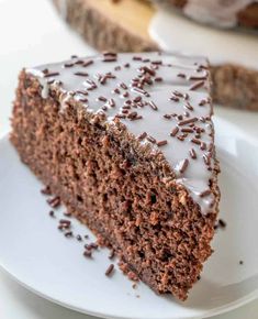 a slice of chocolate cake on a white plate