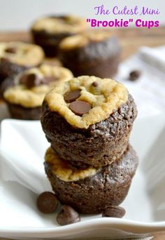 three chocolate chip cookies stacked on top of each other in front of white plates and napkins