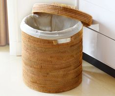 a basket sitting on the floor next to a door