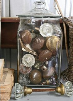 a glass jar filled with lots of coins