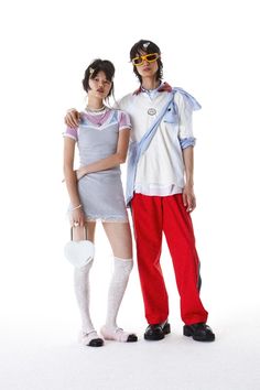 two people standing next to each other in costume