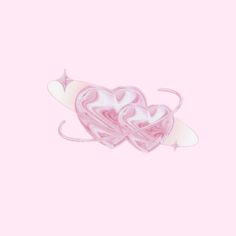 a pink and white heart shaped object on a pink background