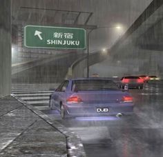 there are many cars that are driving in the rain