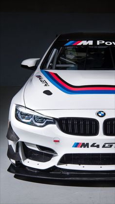 the bmw m4 dtm car is on display