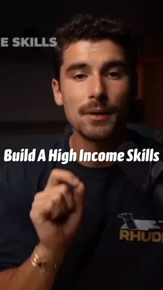 a man holding his fist up in front of him with the words build a high income skills