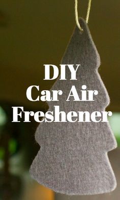 a felt christmas tree ornament hanging from a string with the words diy car air freshener on it