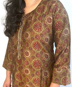 Beautiful, printed kurta and pant. It has prints along with gold print highlighting in a rayon silk material. Note:  Product color may have slight variations due to surrounding light. Silk Kurta With Printed Motifs For Diwali, Traditional Silk Palazzo Set With Bandhani Print, Printed Silk Kurta For Festive Occasions, Sharara With Kalamkari Print For Festivals, Kalamkari Print Sharara For Festivals, Festival Palazzo Set With Dupatta And Tunic Top, Festive Summer Tunic Palazzo Set, Summer Festive Tunic Palazzo Set, Traditional Silk Palazzo Set With Block Print