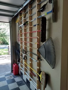 a garage with tools hanging on the wall