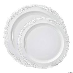 three white plates sitting side by side on top of each other, one is empty