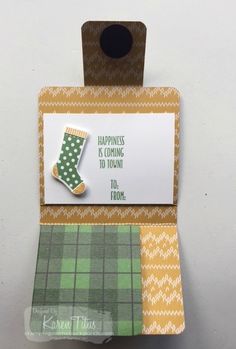 a card with a green boot on it and a tag that says happiness is coming to you