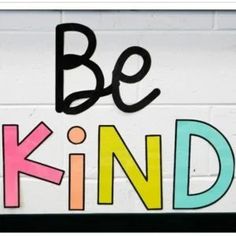 a sign that says be kind on it