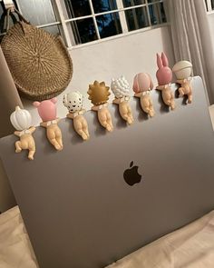 an apple laptop with some cute little animals on it