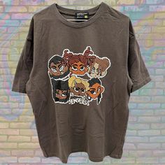 Label size: Large Recommended size: Large How it fits: Regular Pit to pit: 23" Shoulder to bottom: 29" Flaws: Photos show marks if any Material : 100% Cotton Era: Y2K Colour: Brown/Multicolor Oversized Y2k Tops With Logo Print, Oversized Y2k Top With Logo Print, Y2k T-shirt With Character Print For Streetwear, Y2k Character Print T-shirt For Streetwear, Y2k Style Character Print T-shirt For Streetwear, Streetwear Cotton Tops With Cartoon Print, Streetwear Cartoon Print Cotton Tops, Cotton Cartoon Print Tops For Streetwear, Relaxed Fit Cartoon Print Tops For Streetwear