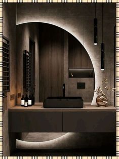 a modern bathroom with an oval sink and black countertop, surrounded by dark wood paneling