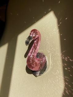 a pink object sitting on top of a white surface