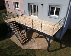 an aerial view of a house with stairs leading up to it