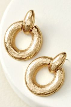 A good pair of hoops are a necessity, and we think you'll wear these ones on repeat! Glistening gold with a vintage-inspired hammered texture and just the right size to pair with countless outfits casual to fancy and everything in between. Post backing. Hammered Hoop Earrings, Tiny Treasures, Copper Earrings, Soft Surroundings, On Repeat, Gold Texture, Outfits Casual, New Shoes, Zinc Alloy