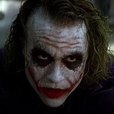 the dark knight joker is looking at something